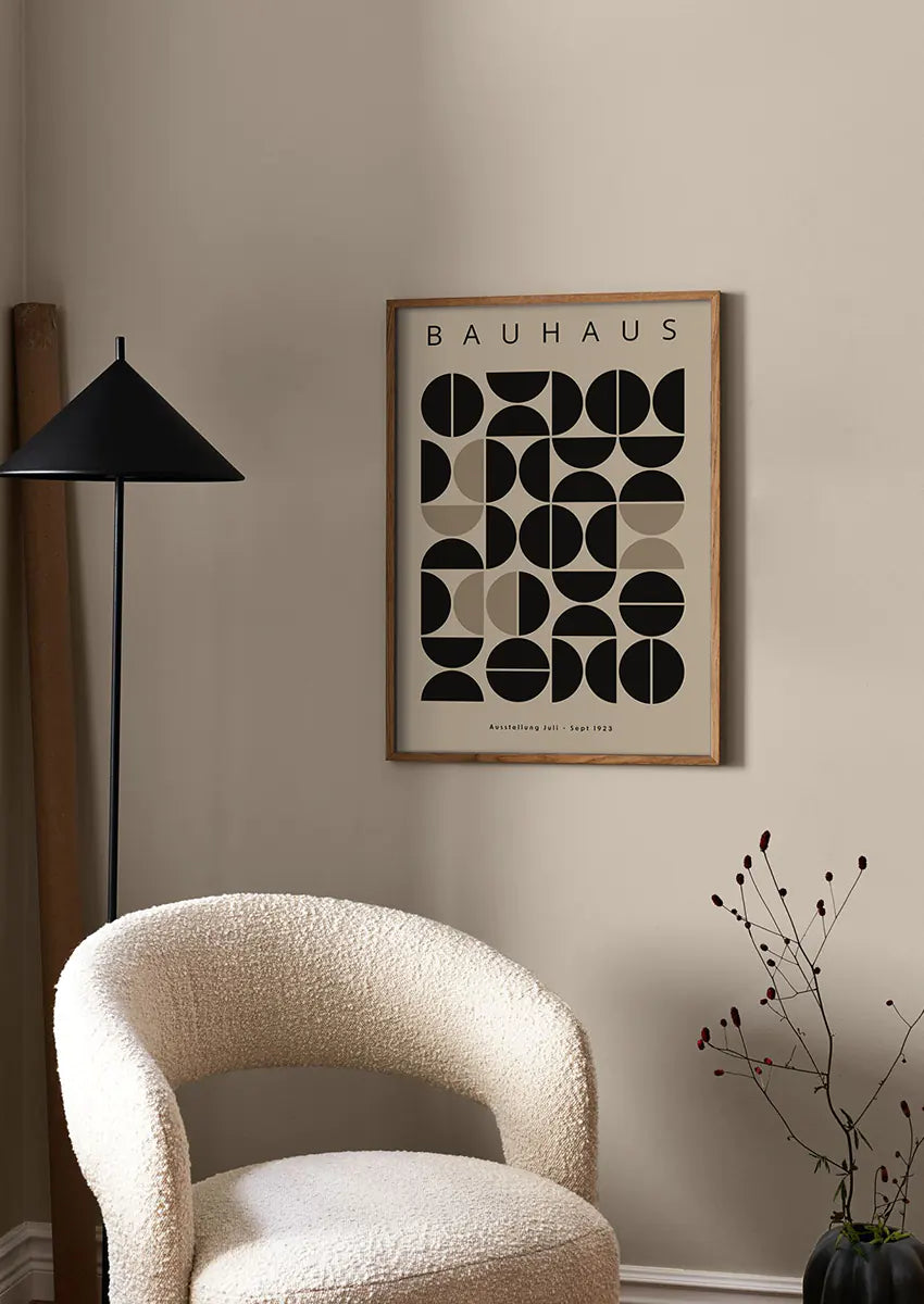 modular motion wall art with black and beige circles and lines